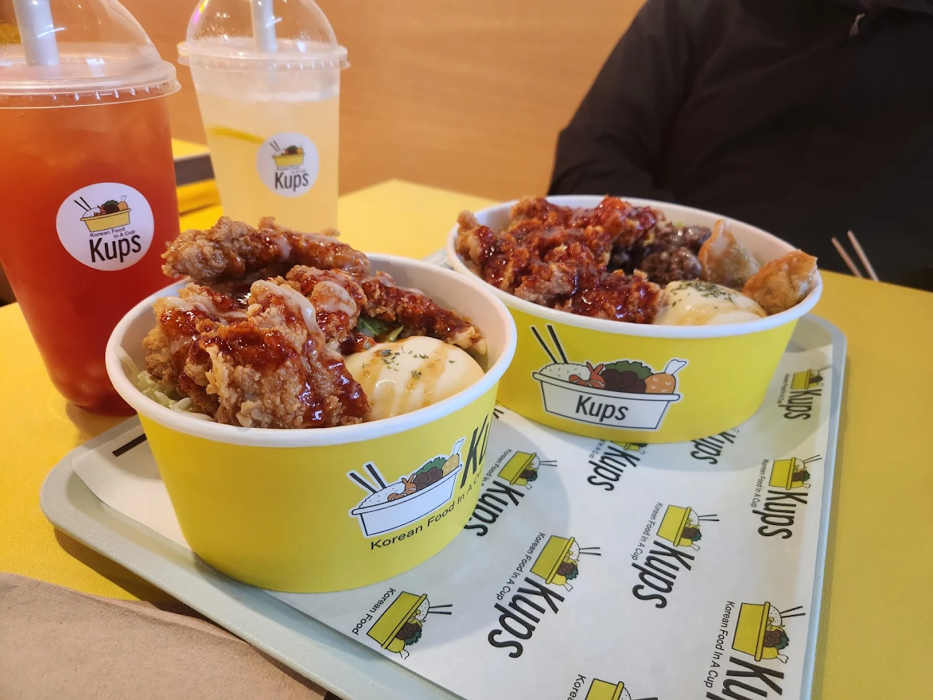 Korean street food menu at Kups Inglewood Calgary featuring fried chicken kups and BBQ rice bowls